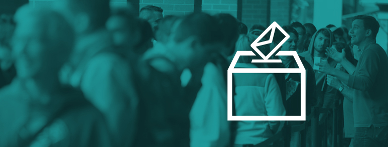 Election Polling - man speaking to people waiting in line