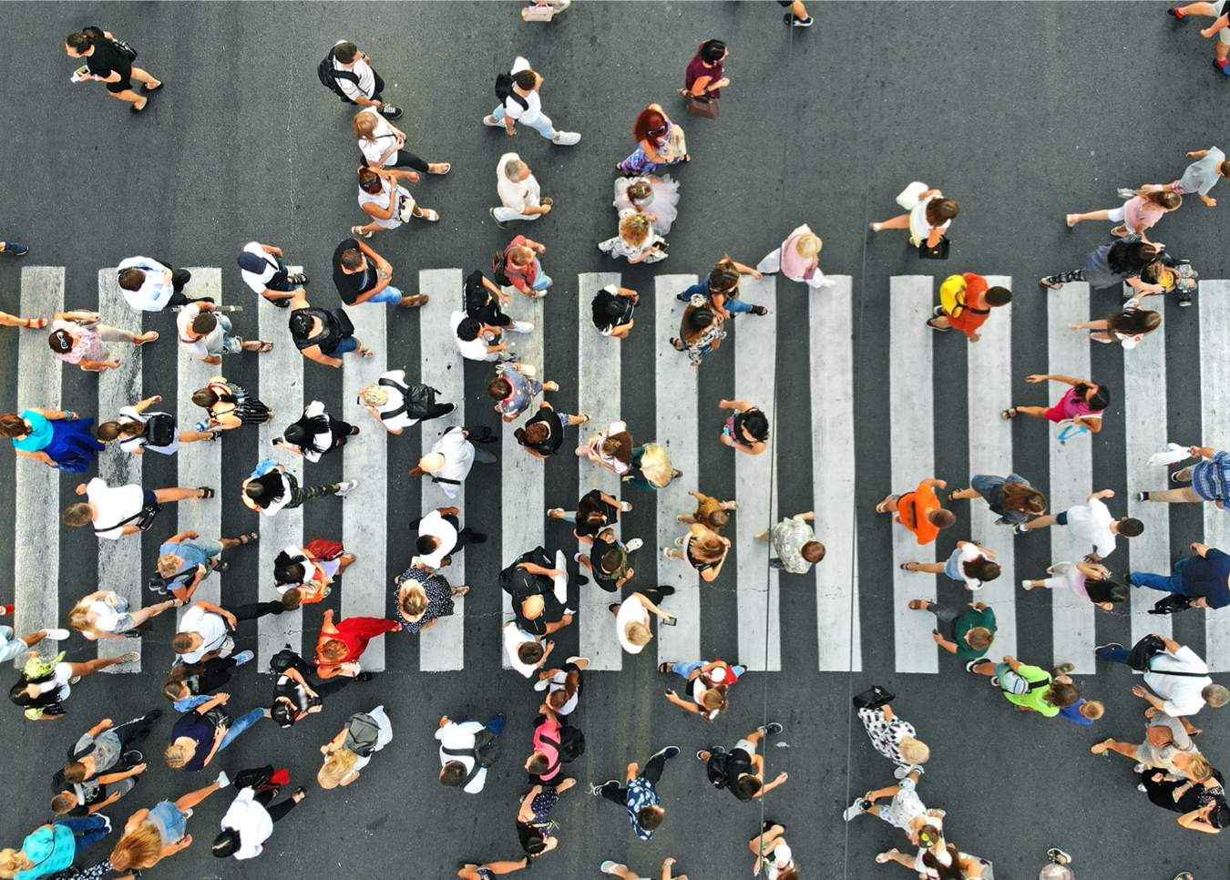 aerial of crowd crossing crosswalk